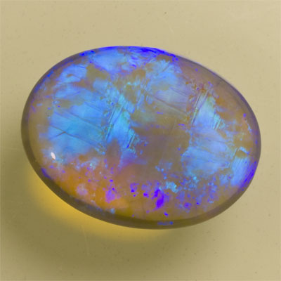 Grande opale cristal noire bleu électrique et turquoise 10.15 ct 18.5 x 13.9 mm